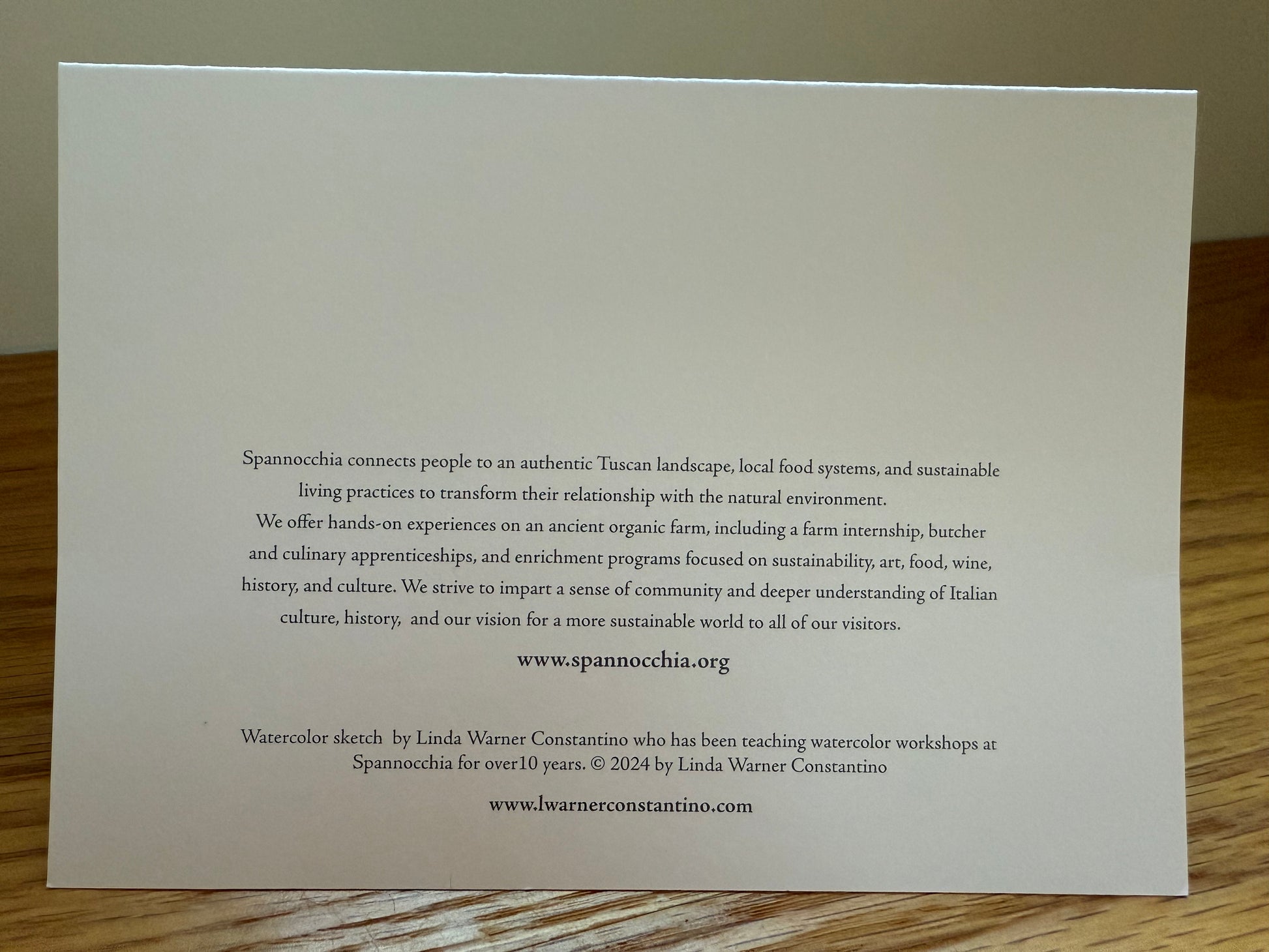 Back of notecard, with short blurb about Spannocchia and Linda Warner Constantino