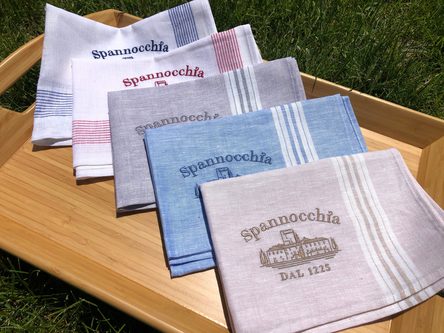 5 linen towels on tray