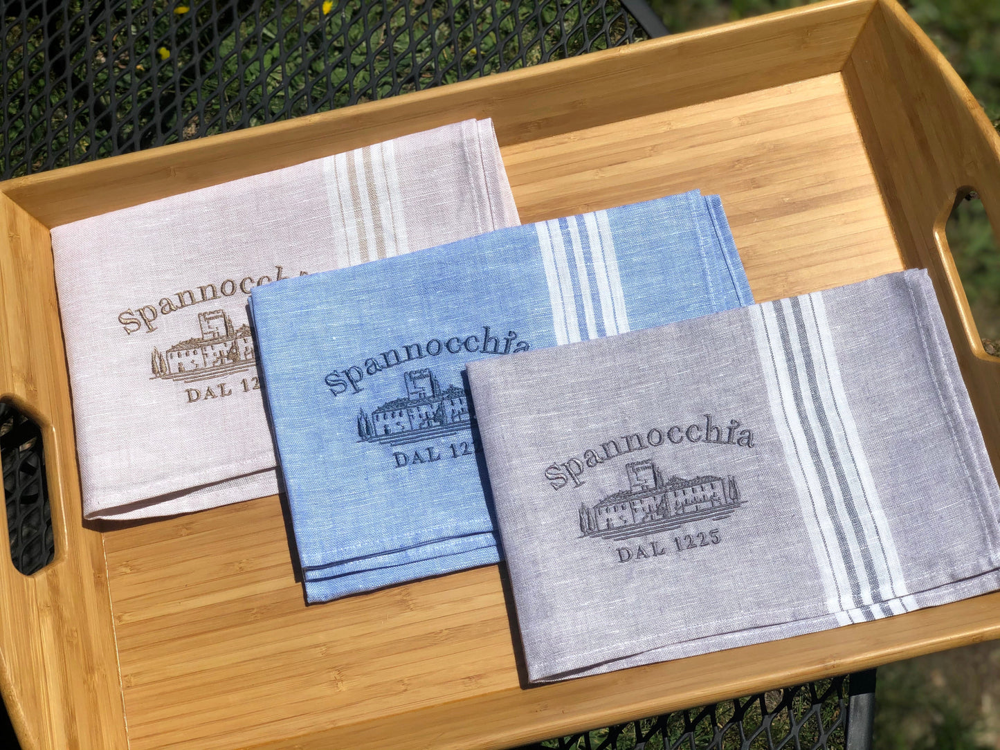 Three linen towels on a tray